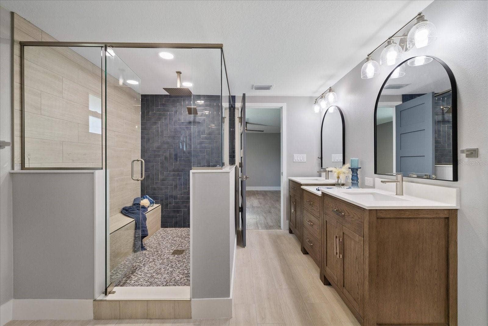 5001 MARLIN DRIVE, New Port Richey, FL 34652 Large walk-in shower with ledge in primary