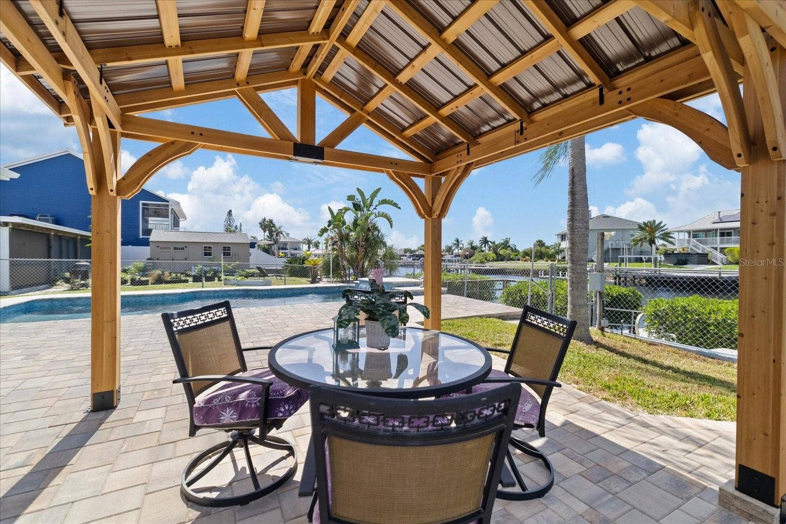 5001 MARLIN DRIVE, New Port Richey, FL 34652 Gazebo shaded area on pavered pool deck