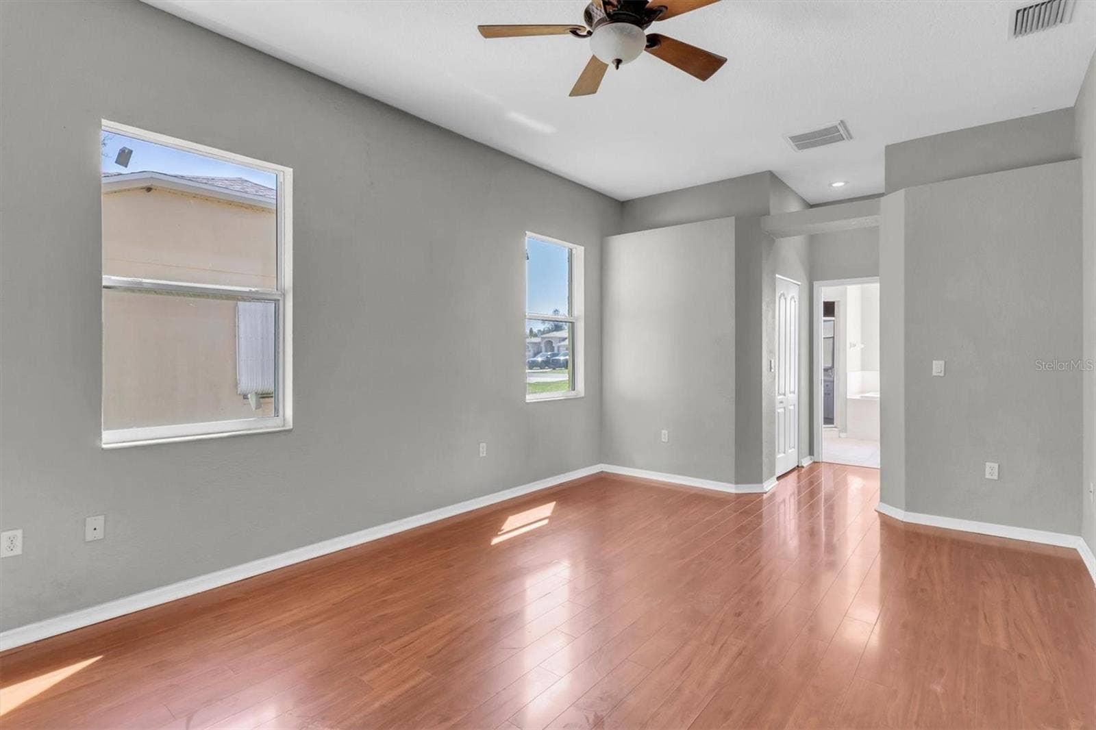15433 SONORA DRIVE, Brooksville, FL 34604 Primary bedroom with hallway leading to the ensuite bathroom