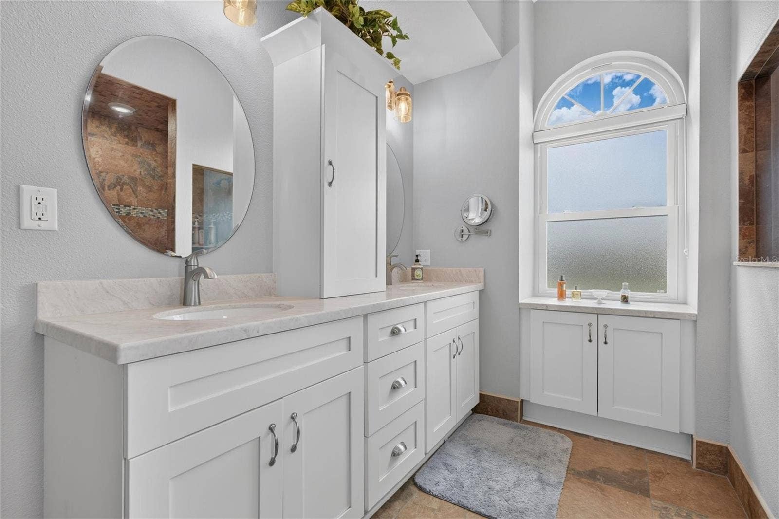 8185 SPANISH OAK DRIVE, Spring Hill, FL 34606 Primary Bathroom with Dual Sinks & Tower