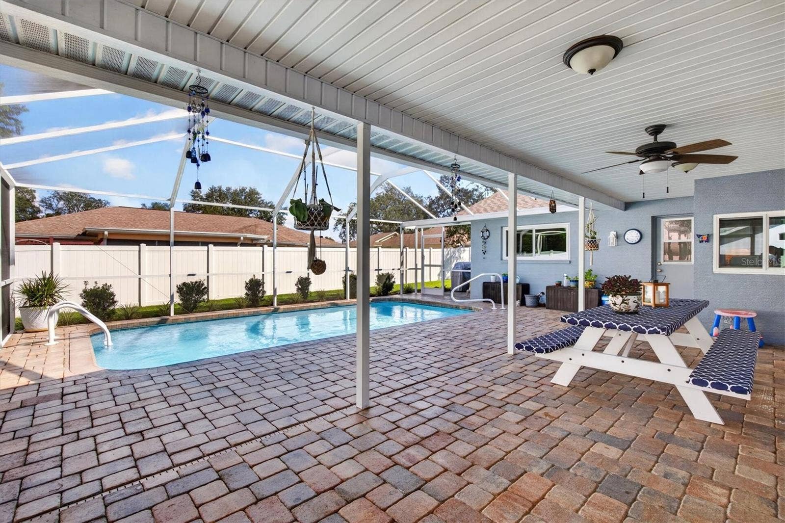 8185 SPANISH OAK DRIVE, Spring Hill, FL 34606 Paved Pool Area & Covered Lanai