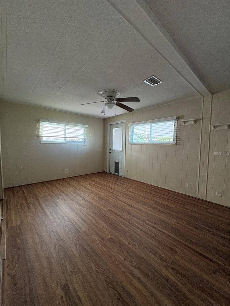 Primary bedroom/rear entry/exit to back porch