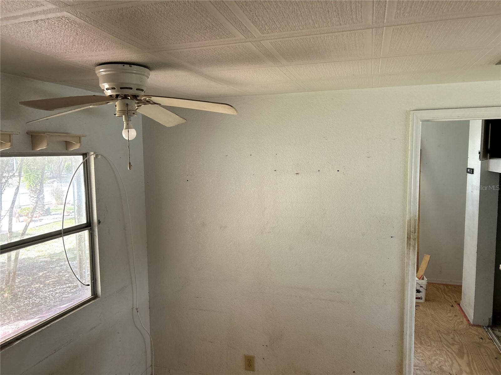 14506 DEHAVEN AVENUE, Brooksville, FL 34613 dining area in kitchen looking into bedroom 2 and living area.
