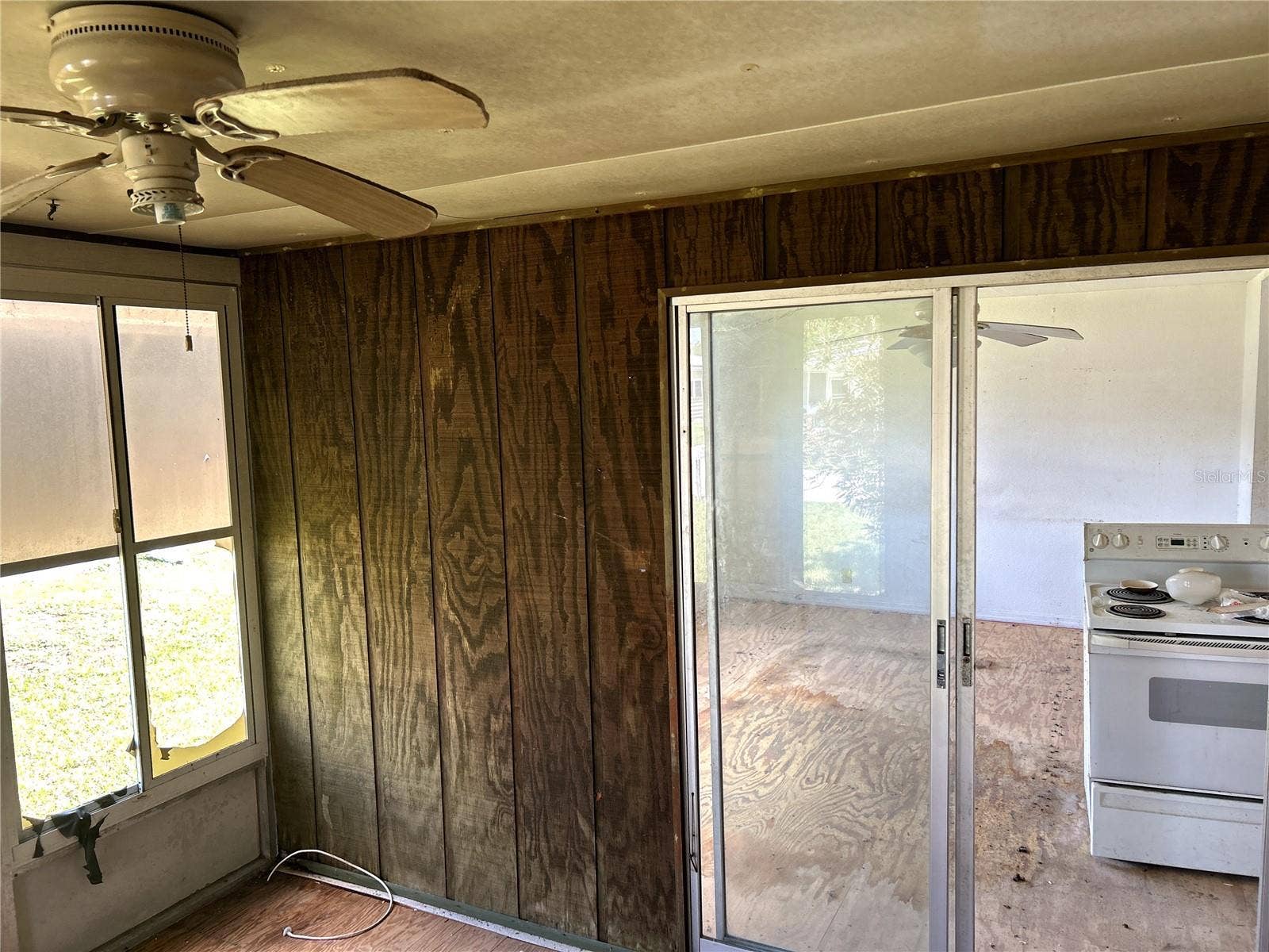 14506 DEHAVEN AVENUE, Brooksville, FL 34613 another view of screened porch into living area.