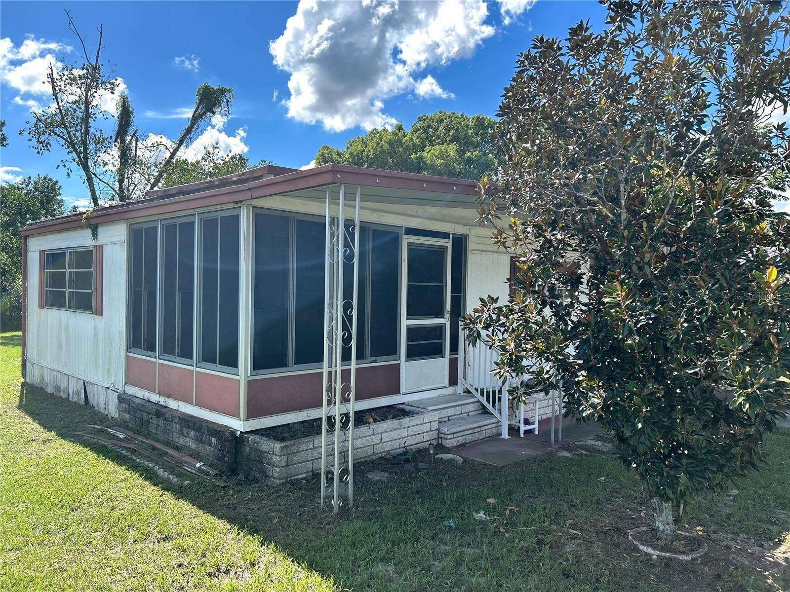 14506 DEHAVEN AVENUE, Brooksville, FL 34613 view of screened porch and living room.