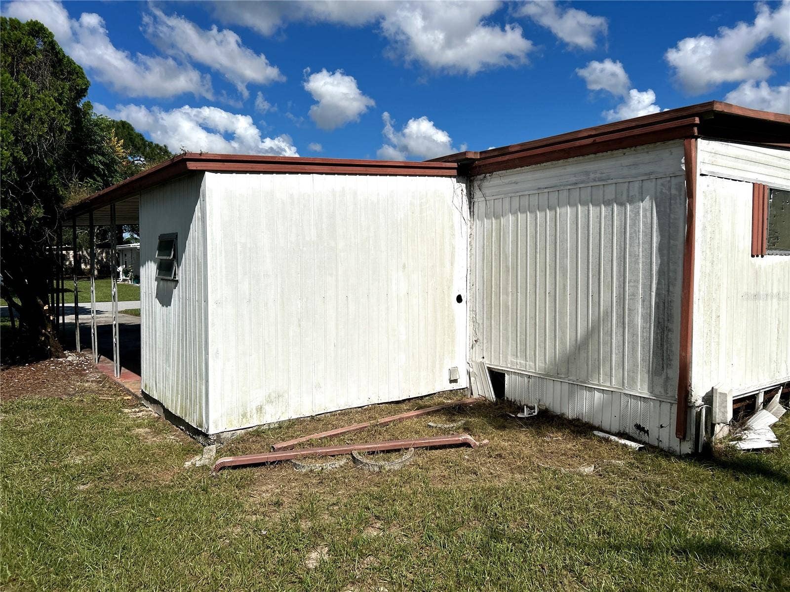 14506 DEHAVEN AVENUE, Brooksville, FL 34613 back view of utility/ laundry room and primary bedroom.