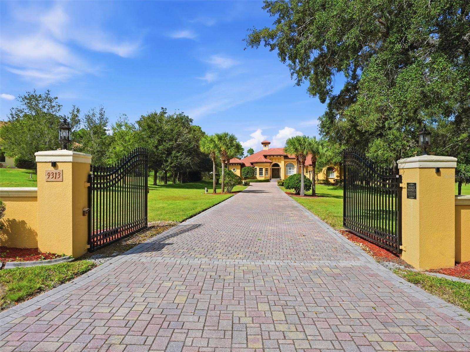 9313 HERNANDO RIDGE ROAD, Weeki Wachee, FL 34613 Private gated entrance to the estate with long brick paver driveway! No detail left untouched!