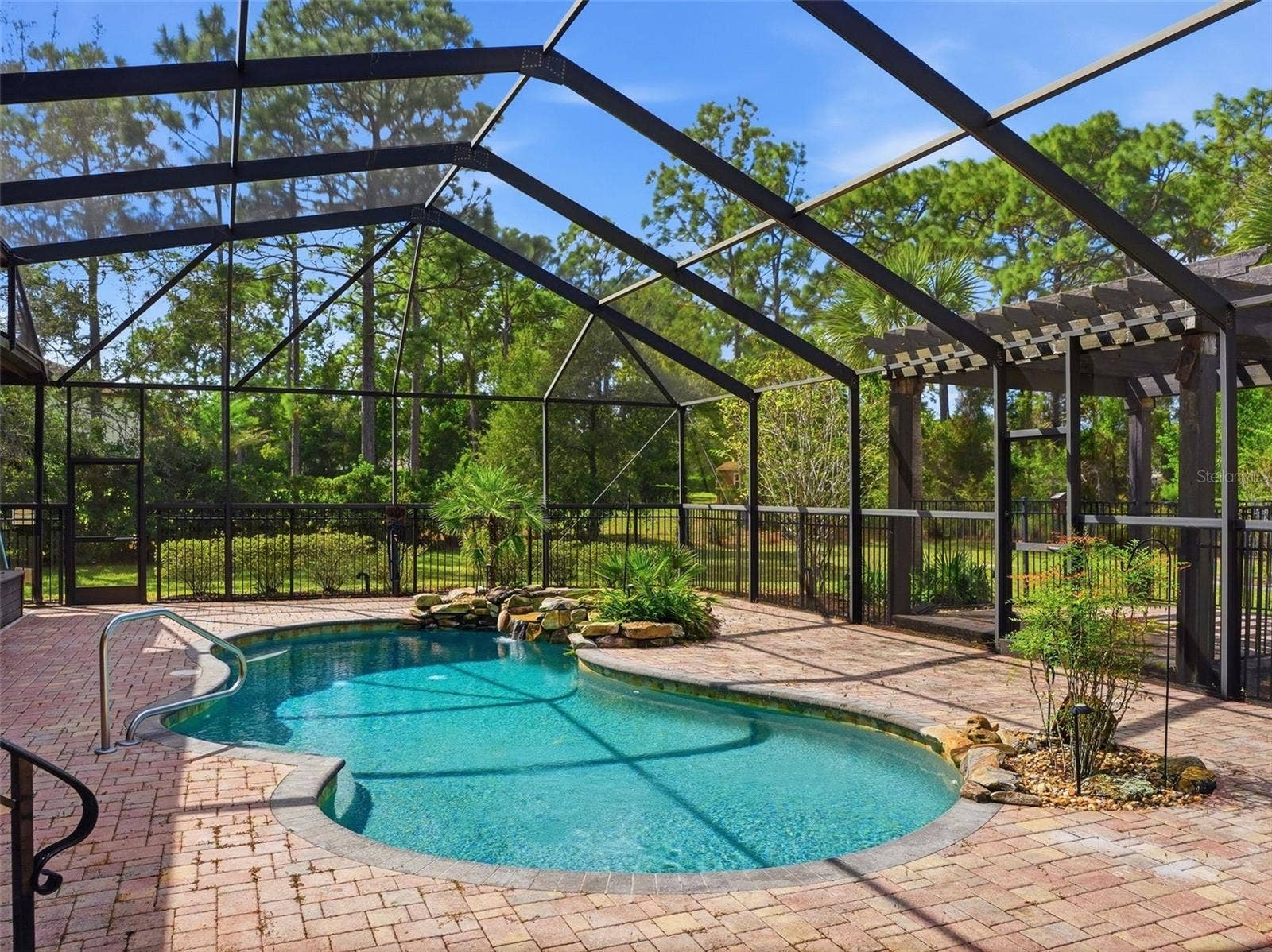 9313 HERNANDO RIDGE ROAD, Weeki Wachee, FL 34613 Brick paver pool deck with high screen enclosure!