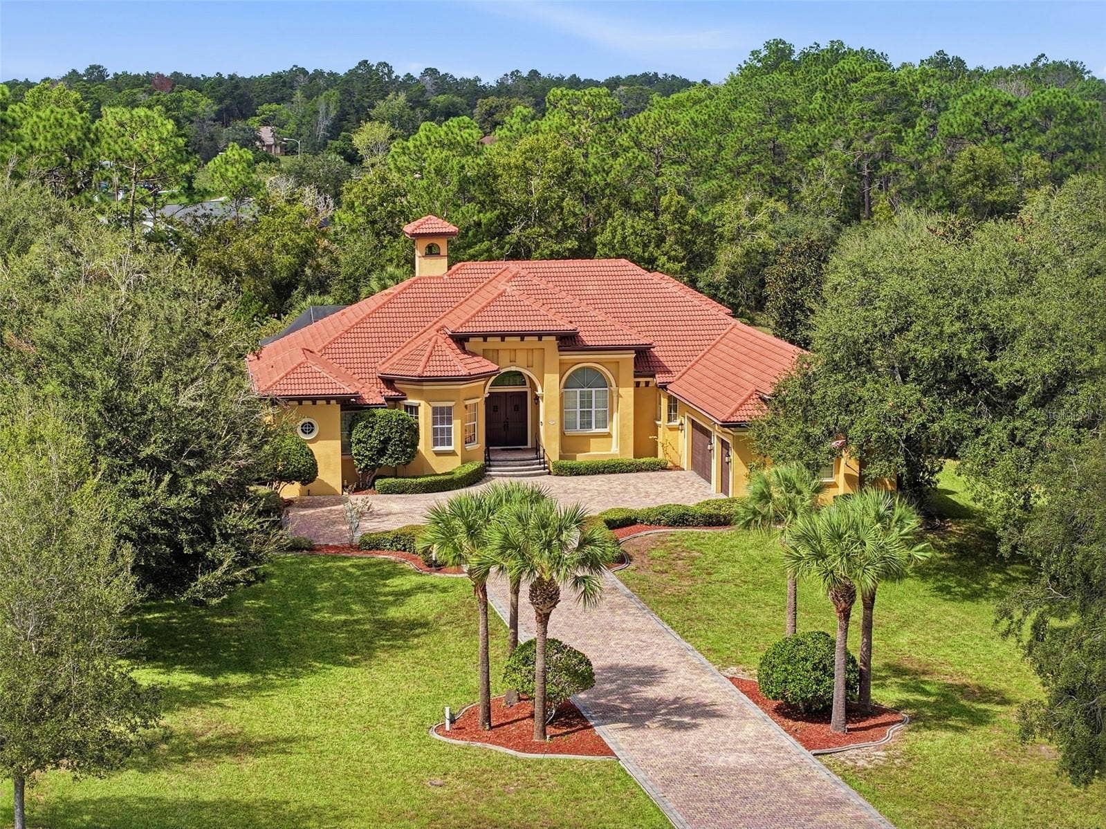 9313 HERNANDO RIDGE ROAD, Weeki Wachee, FL 34613 Incredible roofline with all the peaks and the bell tower accent! Incredible details everywhere!