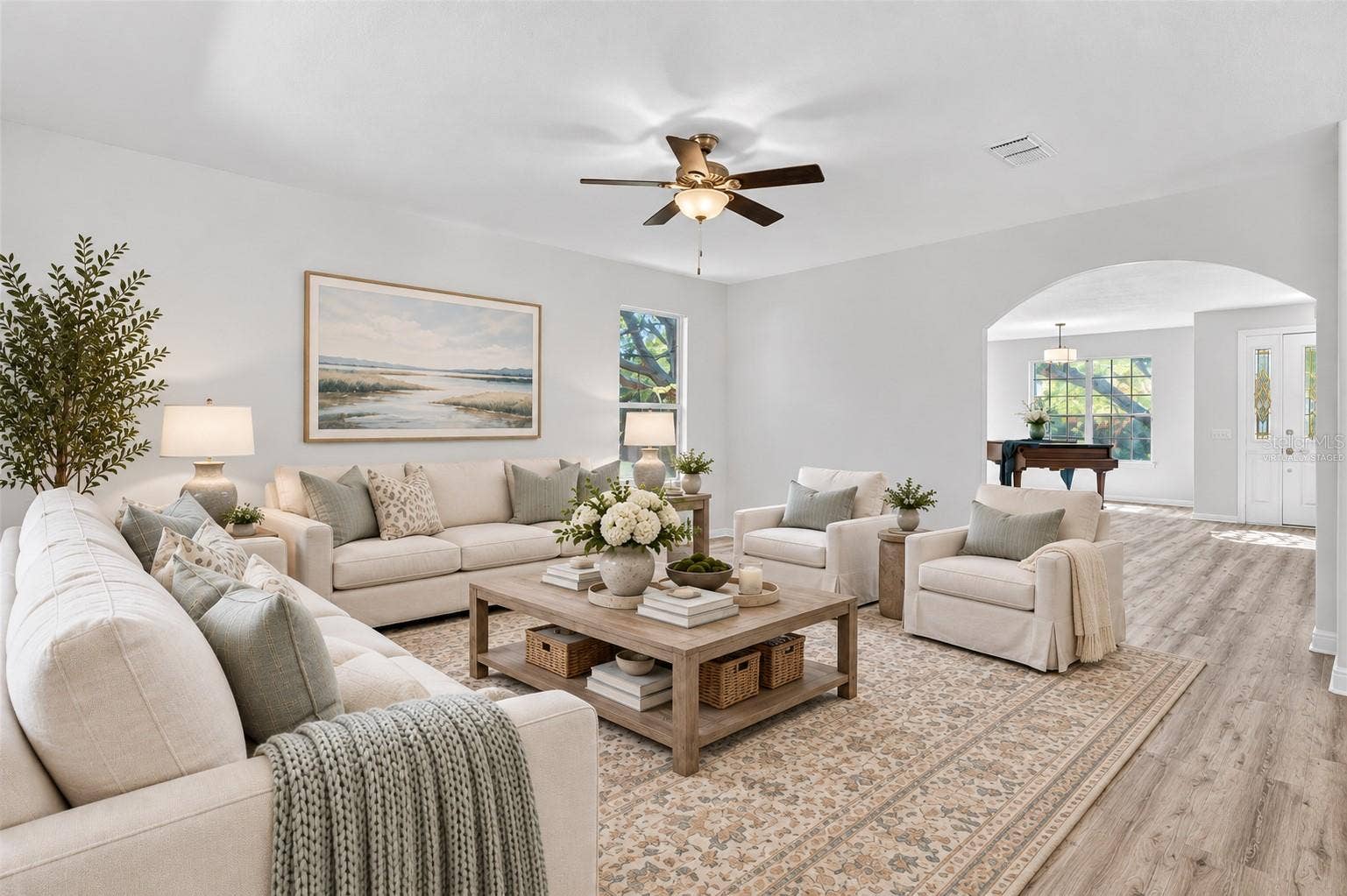 The family room facing the backyard and adjacent to the kitchen. Virtually staged to help you envision your future here.