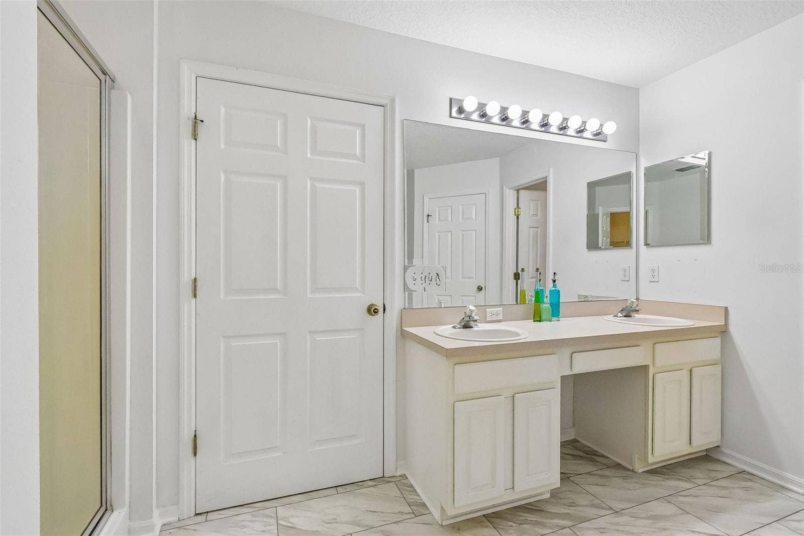 Master bath with water closet, stand up shower, soaking tub, and two walk-in closets.