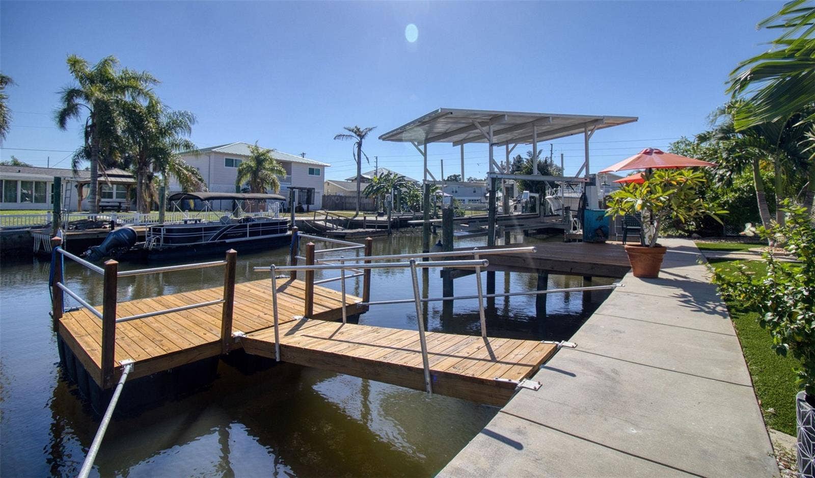 13734 SAN JUAN AVENUE, Hudson, FL 34667 Covered boat lift & floating dock