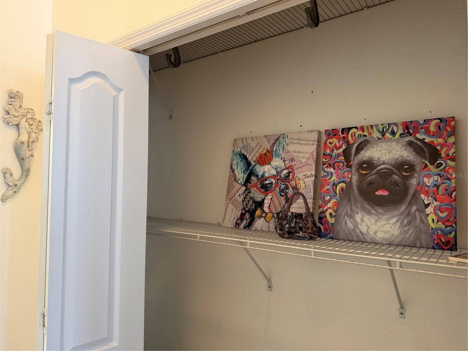 2nd closet in primary bedroom with bifold doors