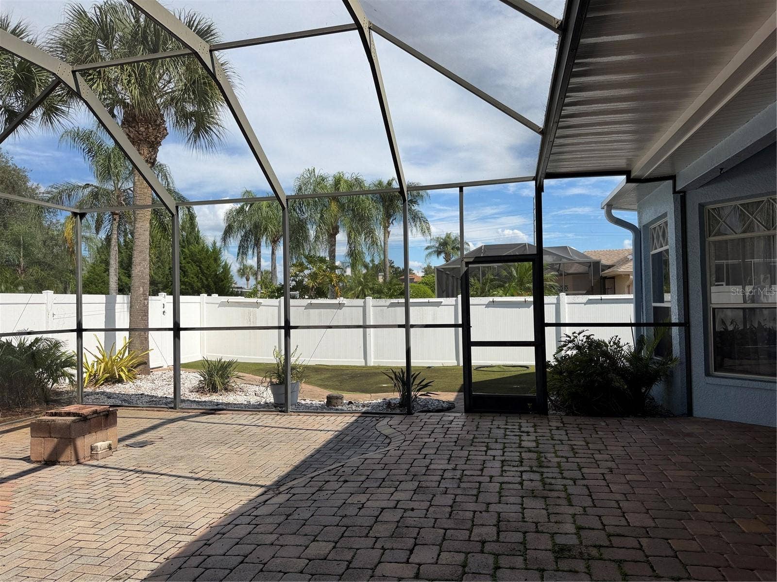 Large Screened lanai has exit to a put put golf area with fake turf