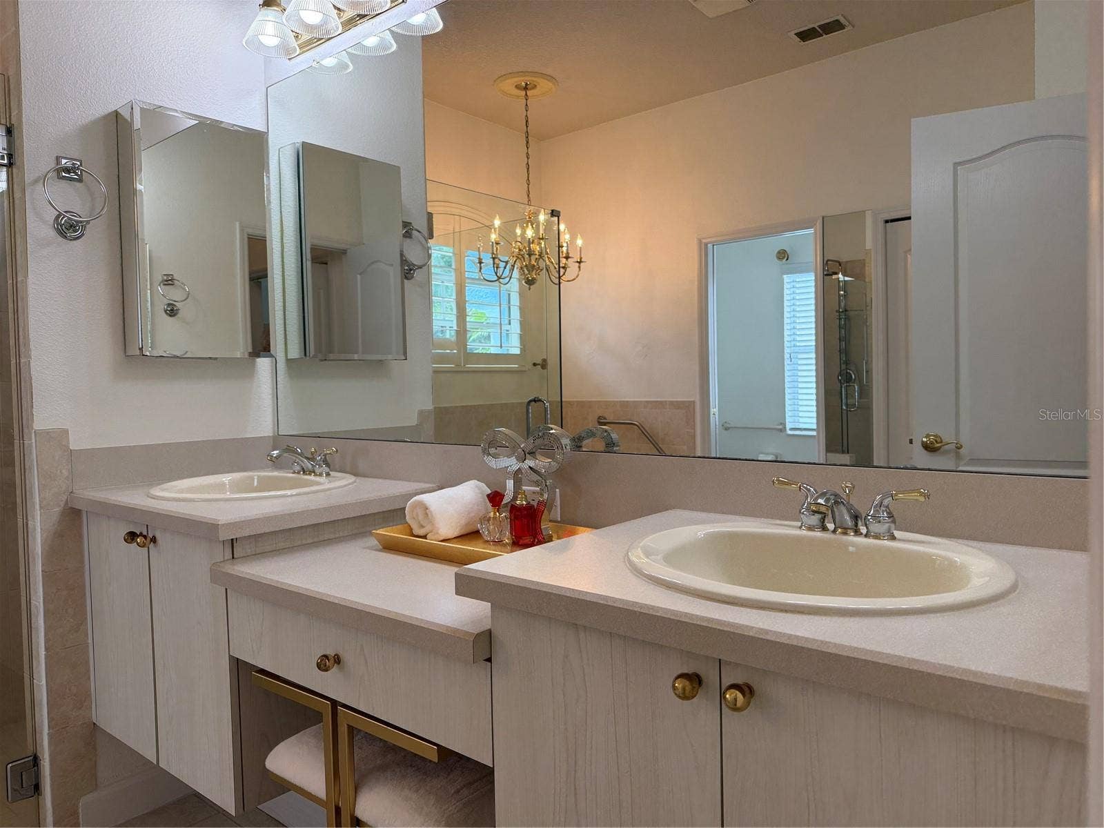 There are two medicine cabinets one on each side of sinks
