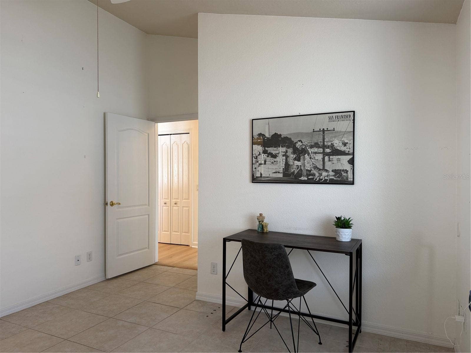 Cathedral ceiling, Door leads to garage, bonus room, laundry, and kitchen
