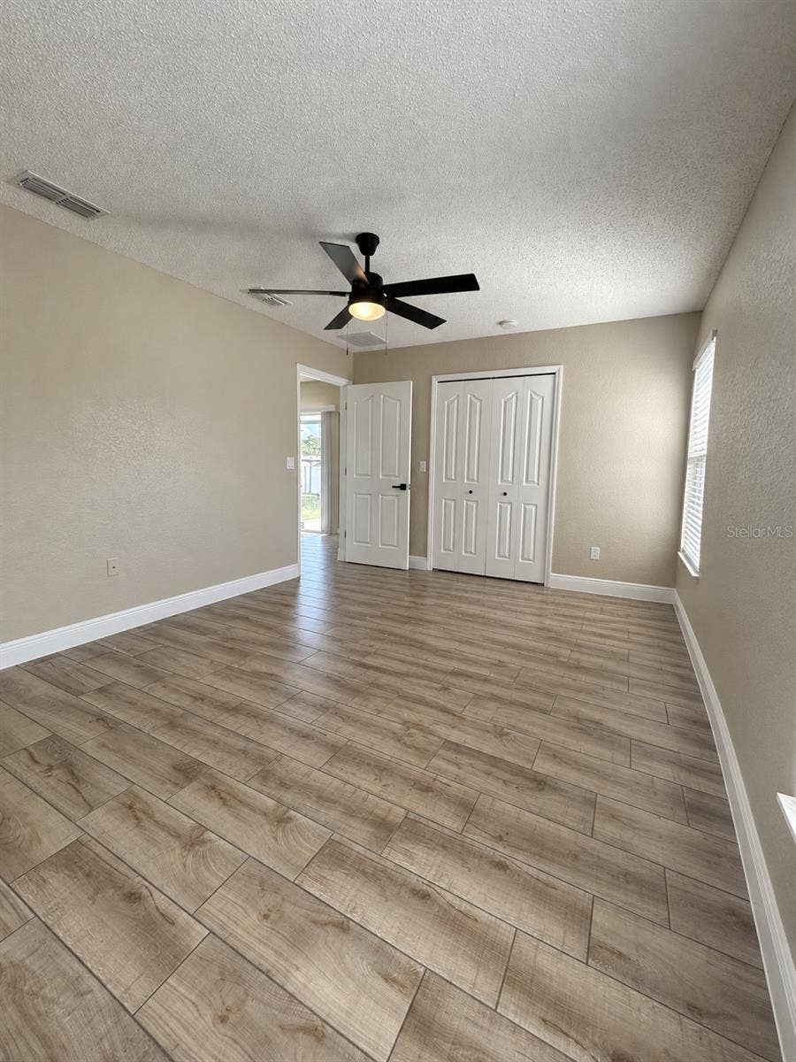10500 TIMBERCREST ROAD, Spring Hill, FL 34608 Primary bedroom and walk-in closet