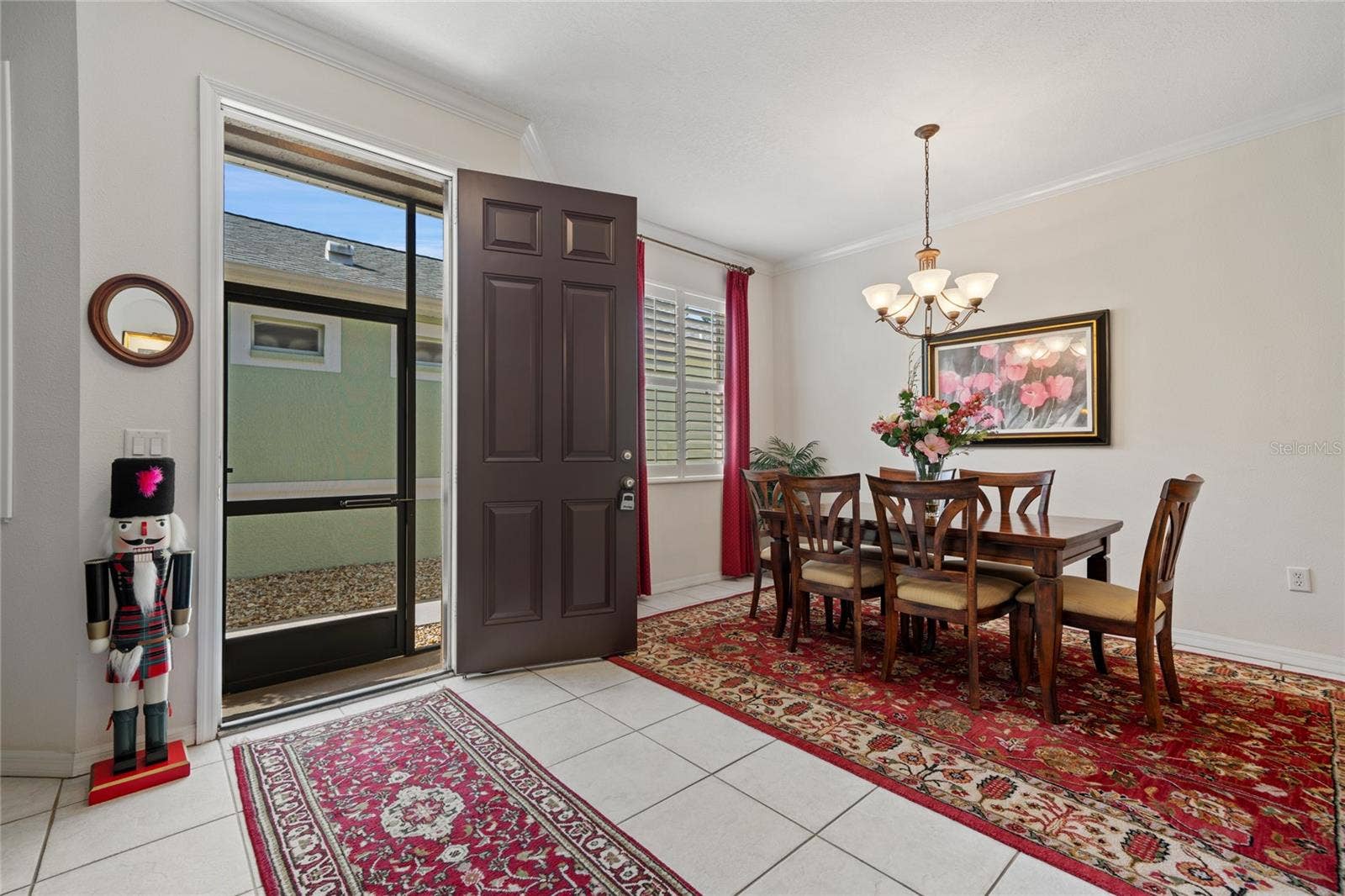 8112 AMBERSWEET PLACE, Land O Lakes, FL 34637 DINING ROOM AND FRONT ENTRANCE