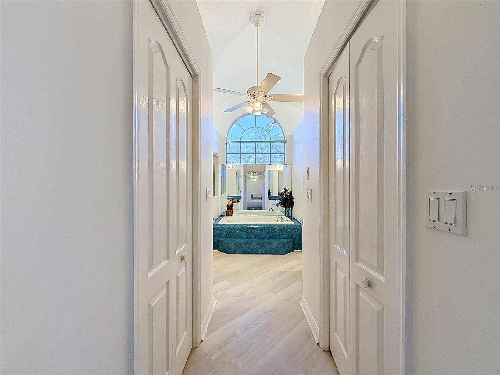 10074 SLEEPY WILLOW COURT, Spring Hill, FL 34608 Owner's suite includes jetted tub, two WICs, linen closet, water closet, two vanities, and large shower.