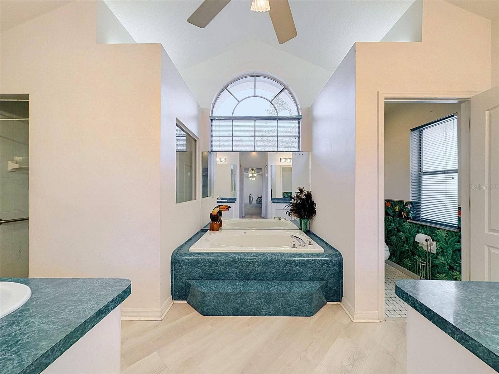 10074 SLEEPY WILLOW COURT, Spring Hill, FL 34608 Owner's suite includes jetted tub, two WICs, linen closet, water closet, two vanities, and large shower.
