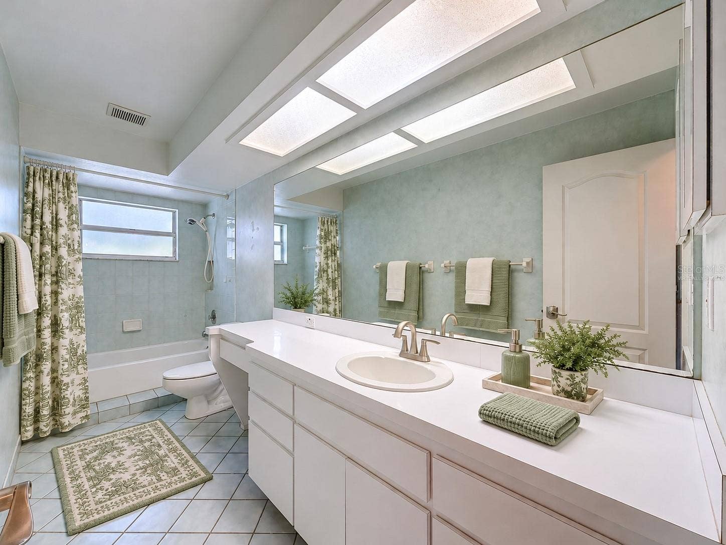 10074 SLEEPY WILLOW COURT, Spring Hill, FL 34608 Hall bathroom is large with lots of storage. (virtually staged)
