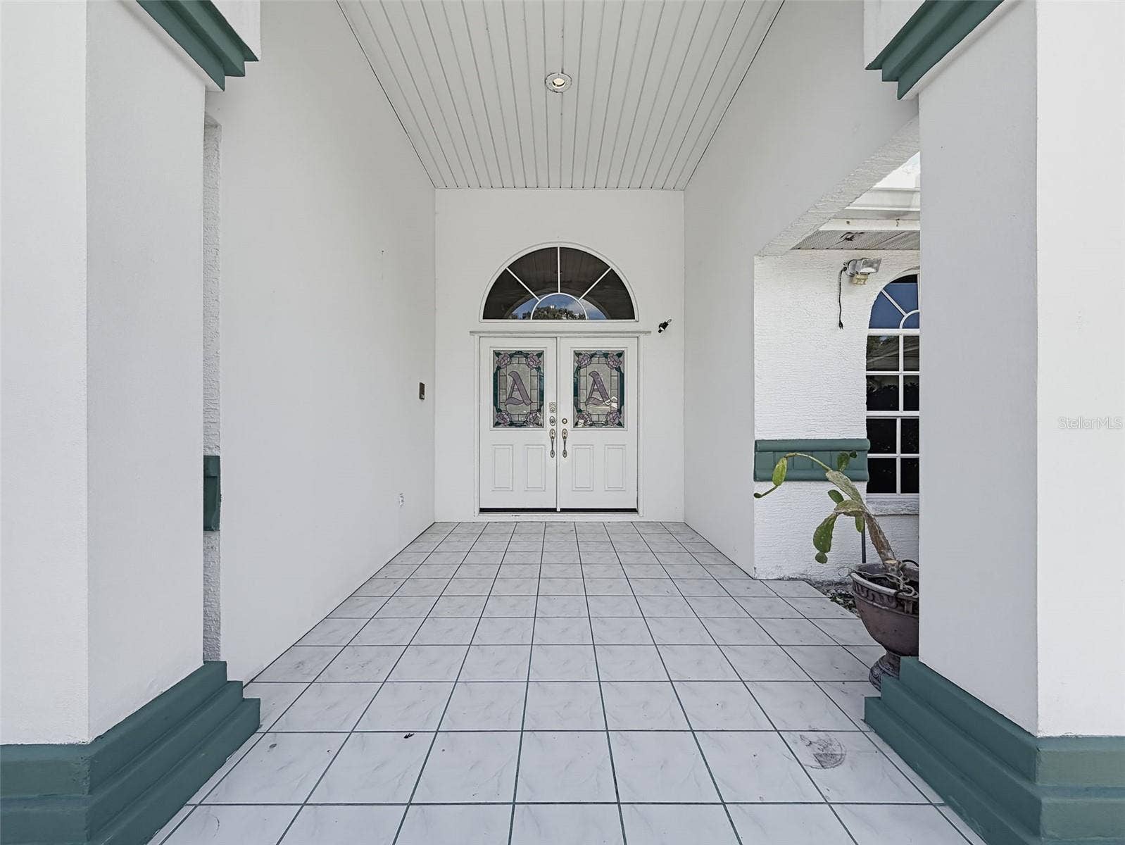 10074 SLEEPY WILLOW COURT, Spring Hill, FL 34608 Large front patio to greet guests.