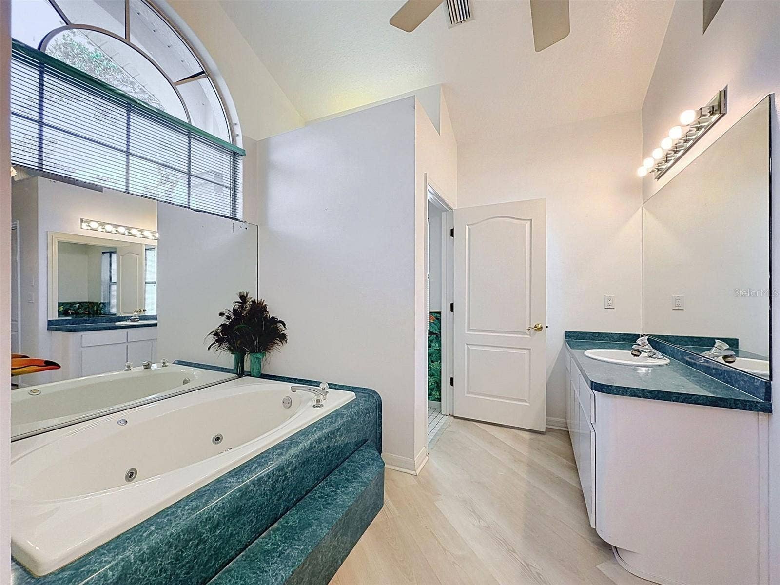 10074 SLEEPY WILLOW COURT, Spring Hill, FL 34608 Owner's suite includes jetted tub, two WICs, linen closet, water closet, two vanities, and large shower.