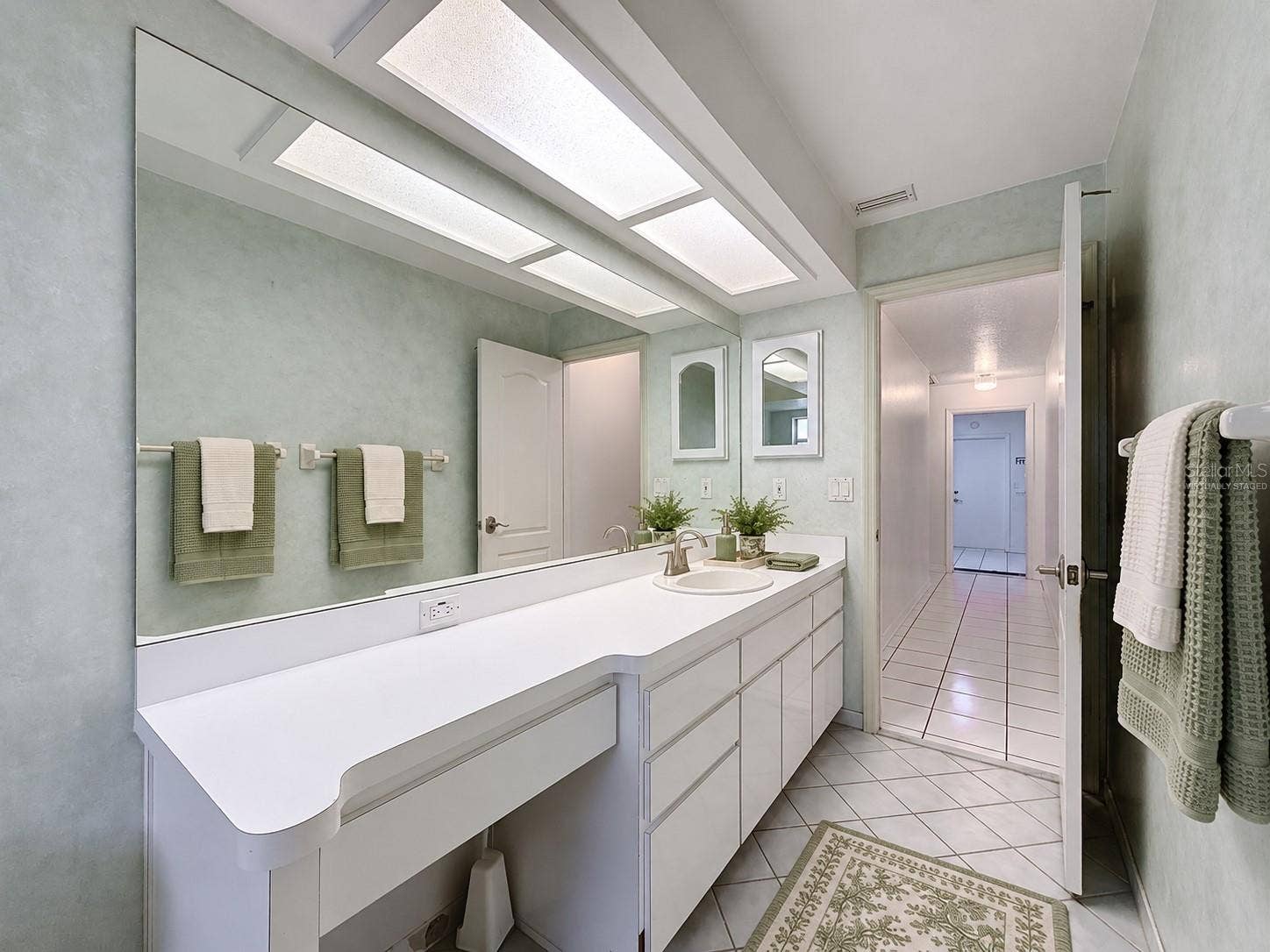 10074 SLEEPY WILLOW COURT, Spring Hill, FL 34608 Hall bathroom is large with lots of storage. (virtually staged)