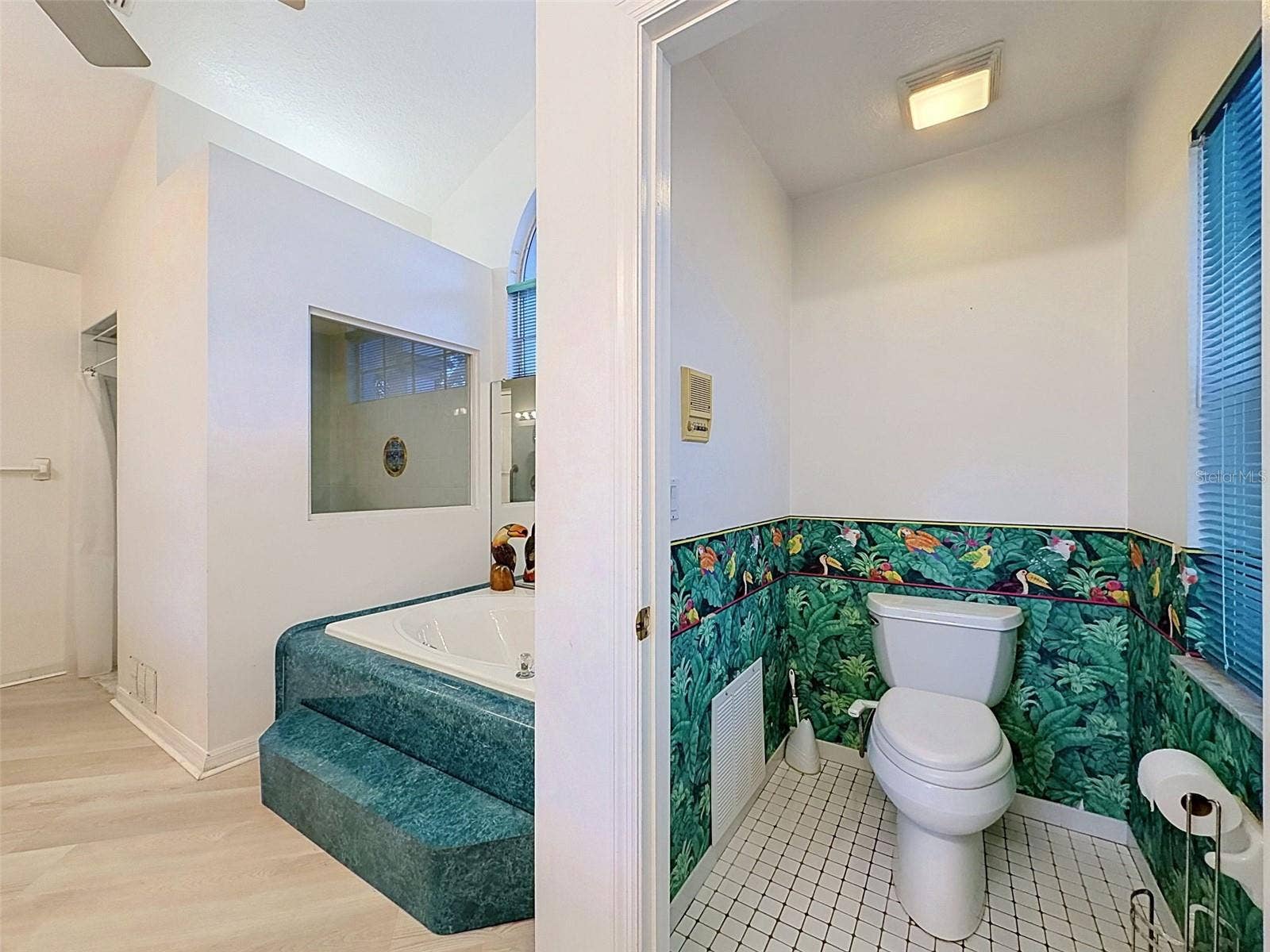 10074 SLEEPY WILLOW COURT, Spring Hill, FL 34608 Owner's suite includes jetted tub, two WICs, linen closet, water closet, two vanities, and large shower.