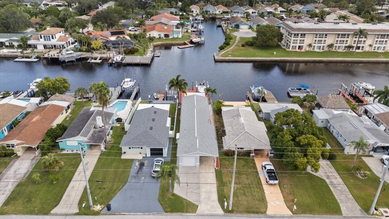 Aerial view of home with wide North channel waterviews in back.