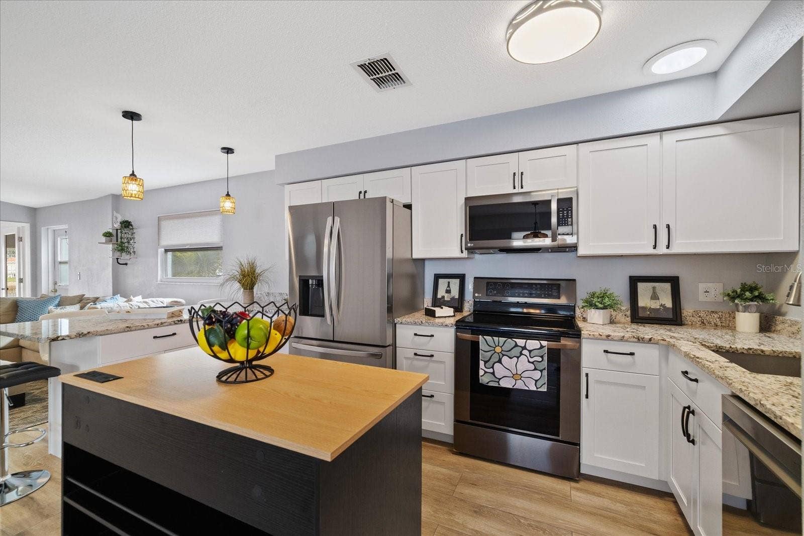 Completely updated kitchen with moveable island for added storage and counter space