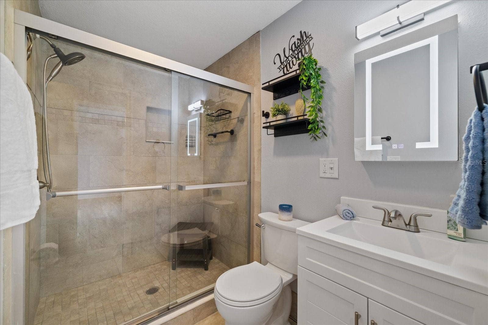Updated bathroom 2 with walk in shower and LED mirror/vanity cabinet