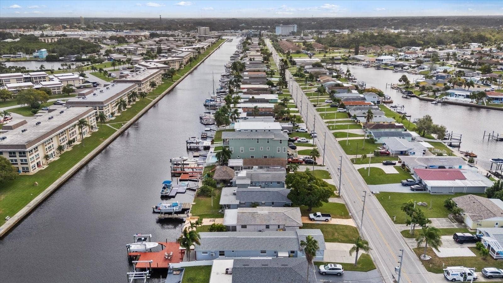 Aerial view of home with red deck and both lift up  North Channel looking east