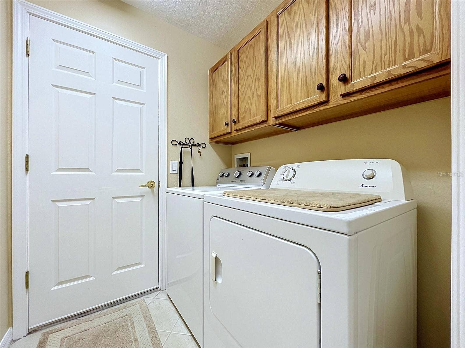 12116 BROADGREEN PLACE, Trinity, FL 34655 Separate laundry room with cabinets