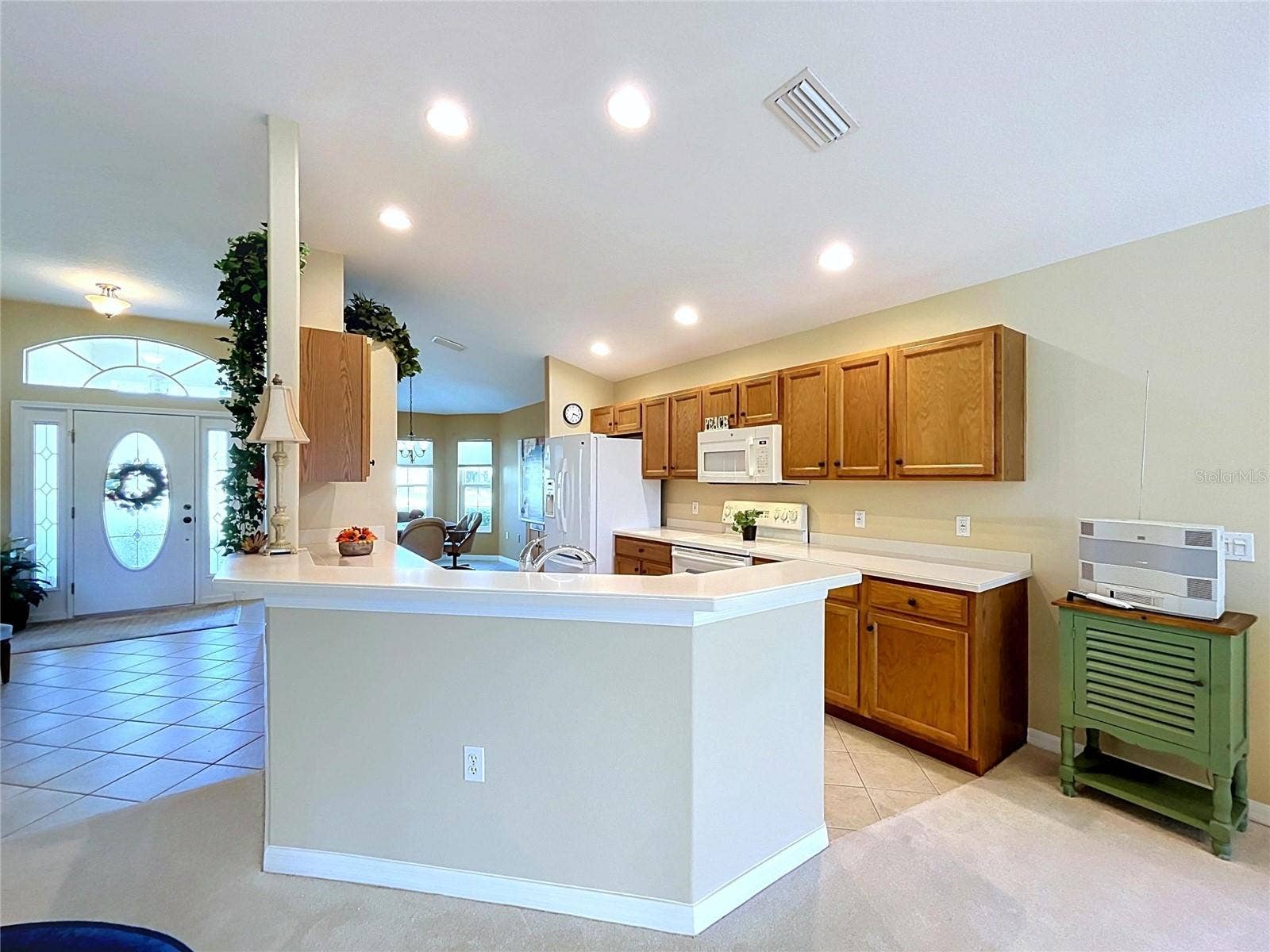 12116 BROADGREEN PLACE, Trinity, FL 34655 Kitchen is in the center of the home