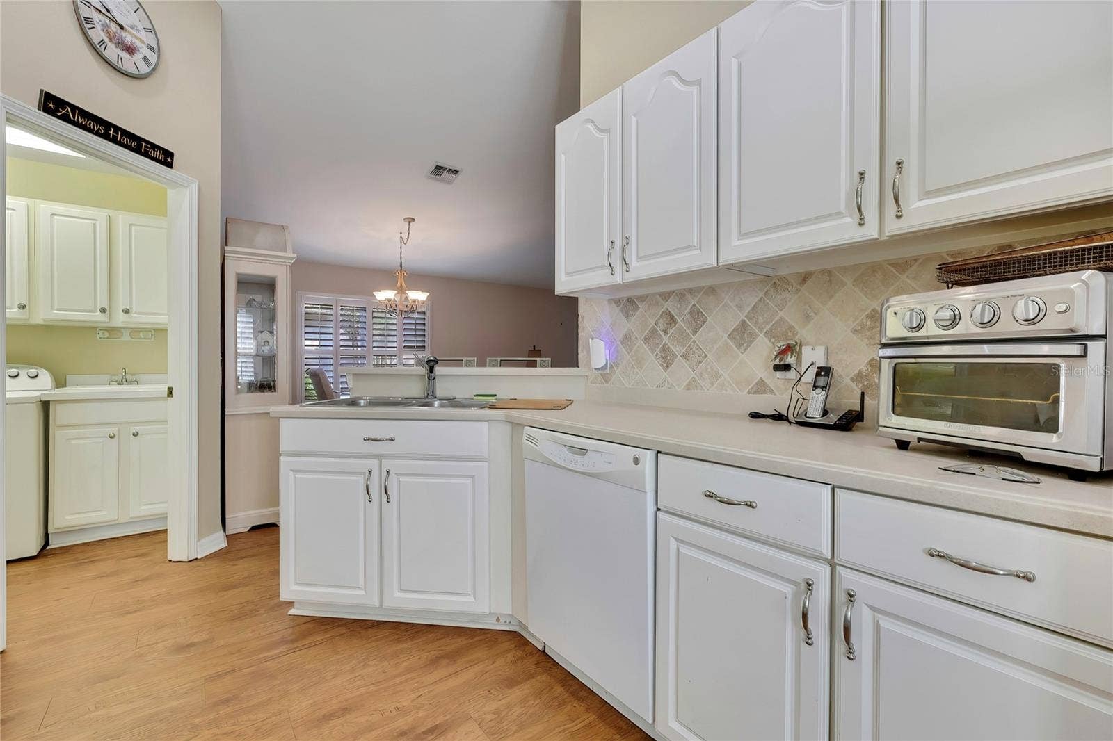 300 HARTFORD COURT, Spring Hill, FL 34609 Wood and Glass Cabinets, Corian Counters