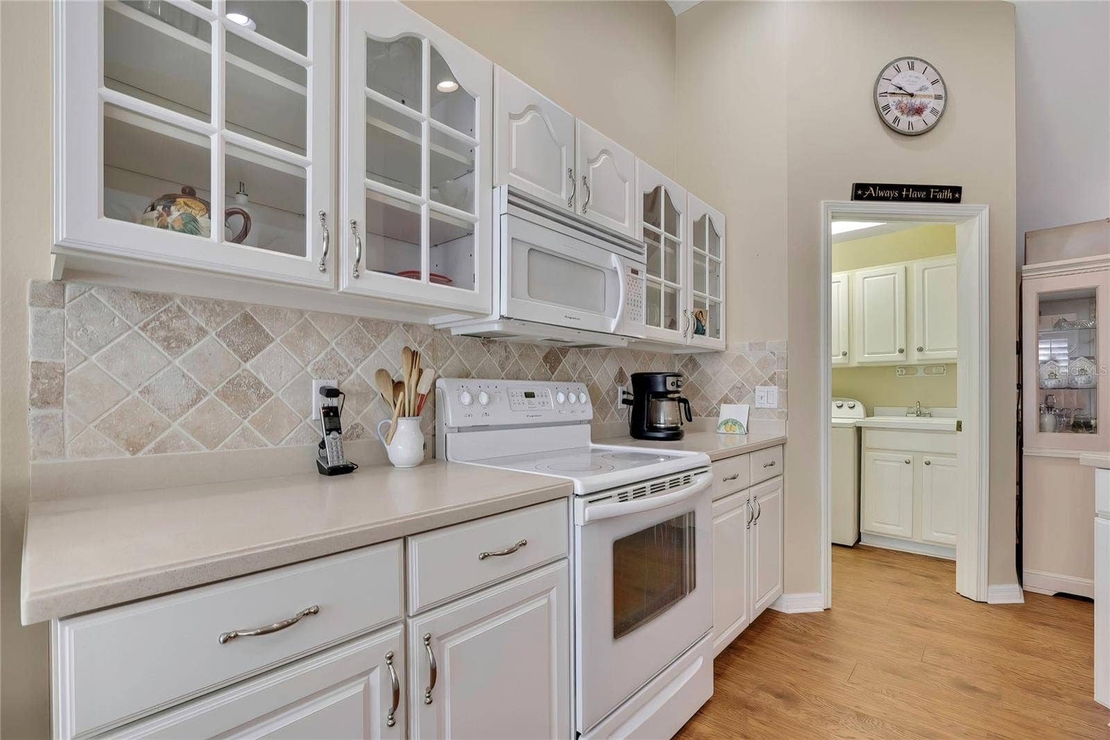 300 HARTFORD COURT, Spring Hill, FL 34609 Kitcen with Wood and Glass Cabinets, Corian Counters