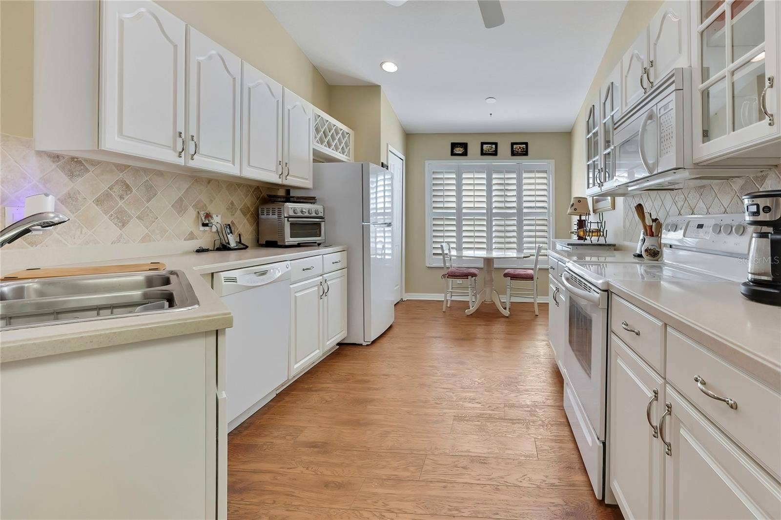 300 HARTFORD COURT, Spring Hill, FL 34609 Wood and Glass Cabinets, Corian Counters