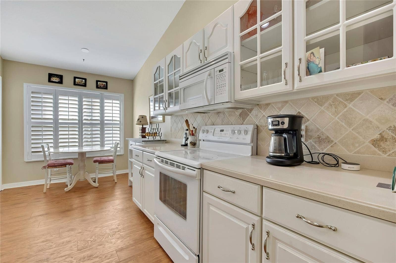 300 HARTFORD COURT, Spring Hill, FL 34609 Wood and Glass Cabinets, Corian Counters