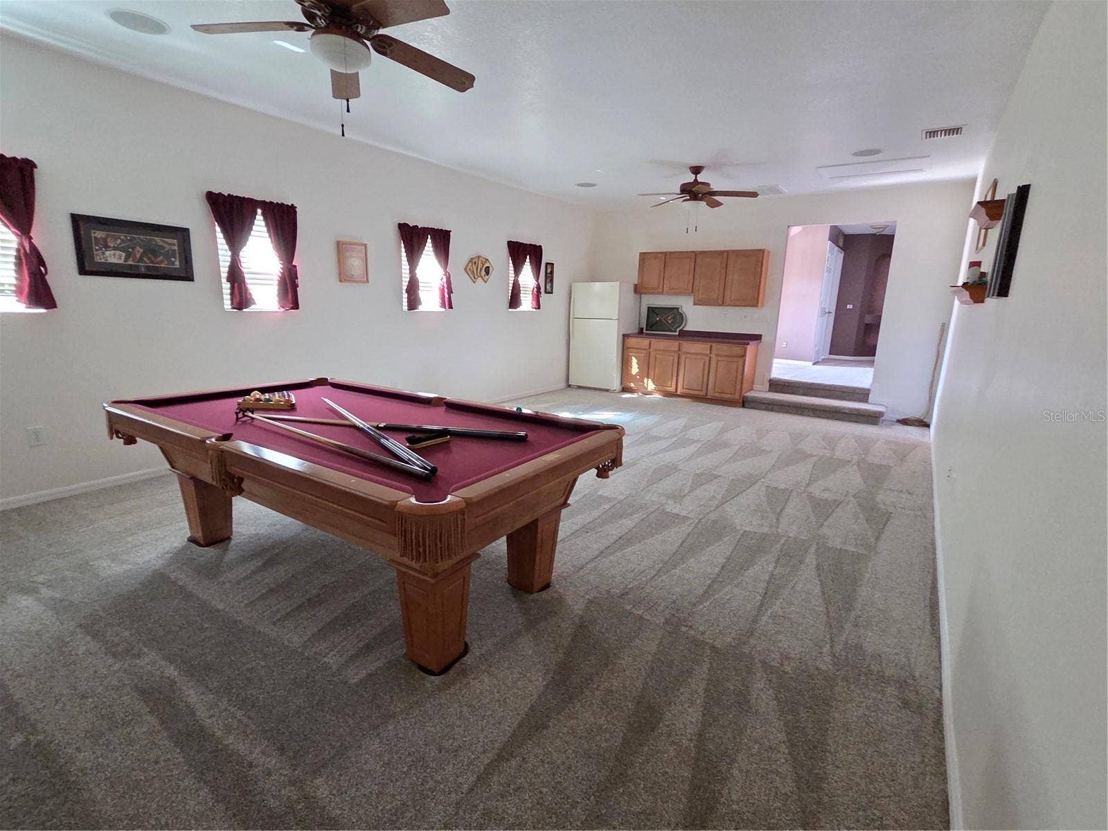 7711 ARELLI DRIVE, New Port Richey, FL 34655 Bonus room upstairs with refrigerator and plumbed for future sink
