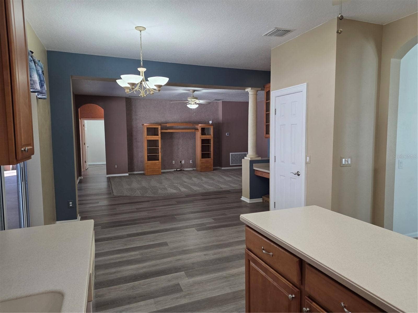 7711 ARELLI DRIVE, New Port Richey, FL 34655 Kitchen eat in area looking into family room