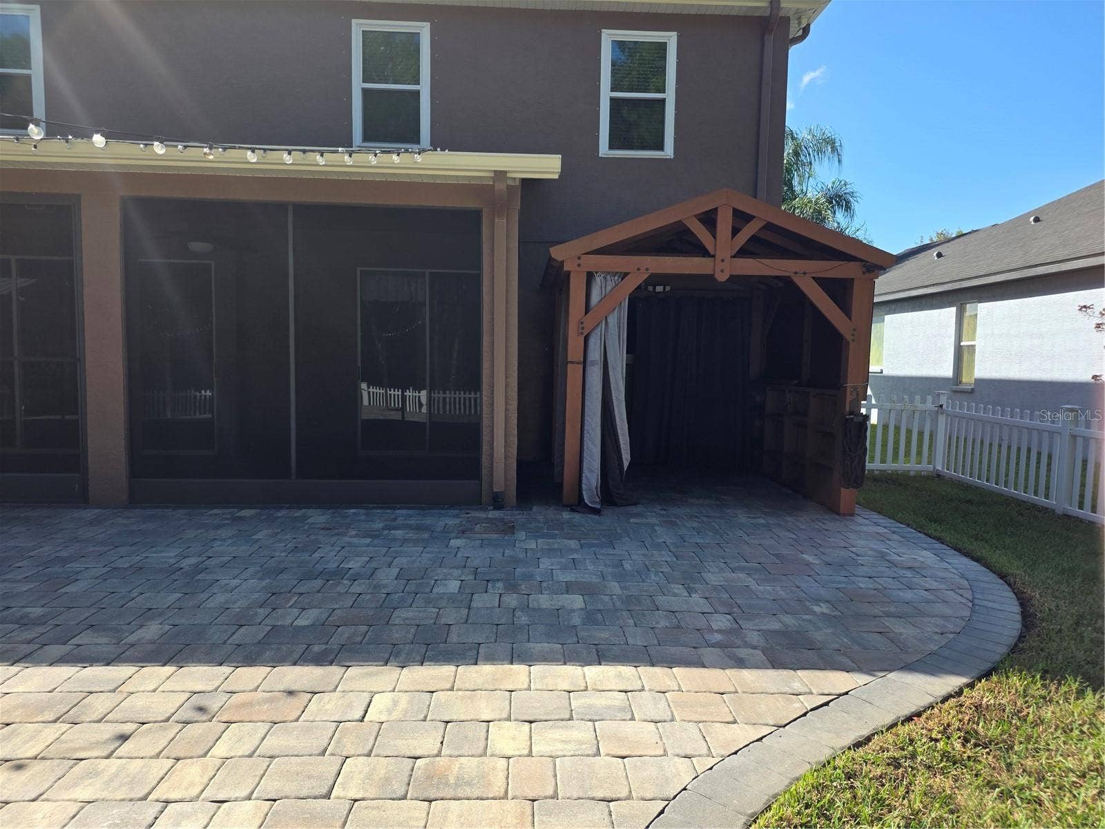 7711 ARELLI DRIVE, New Port Richey, FL 34655 Covered cooking station outside screened lanai