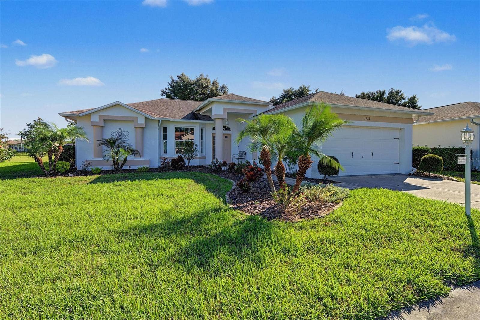 1929 WESTERHAM LOOP, Trinity, FL 34655 Wonderful curb appeal with a covered entry