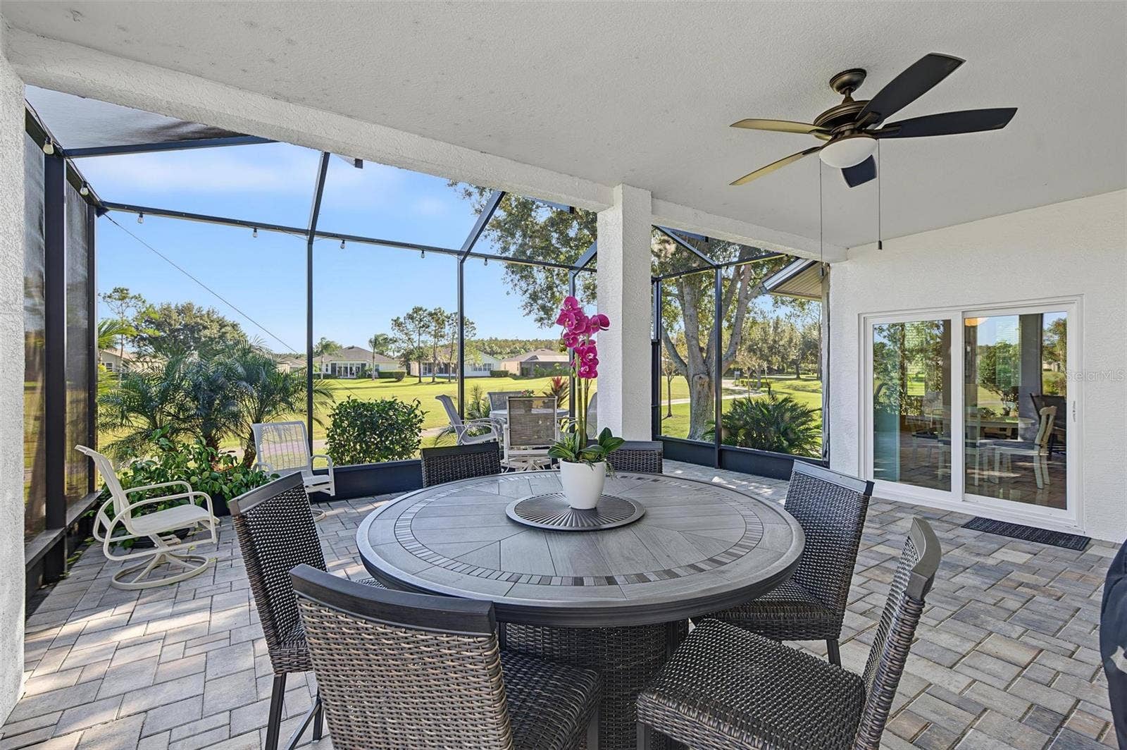 1929 WESTERHAM LOOP, Trinity, FL 34655 Screened in lanai offers a wonderful place to start or end your day