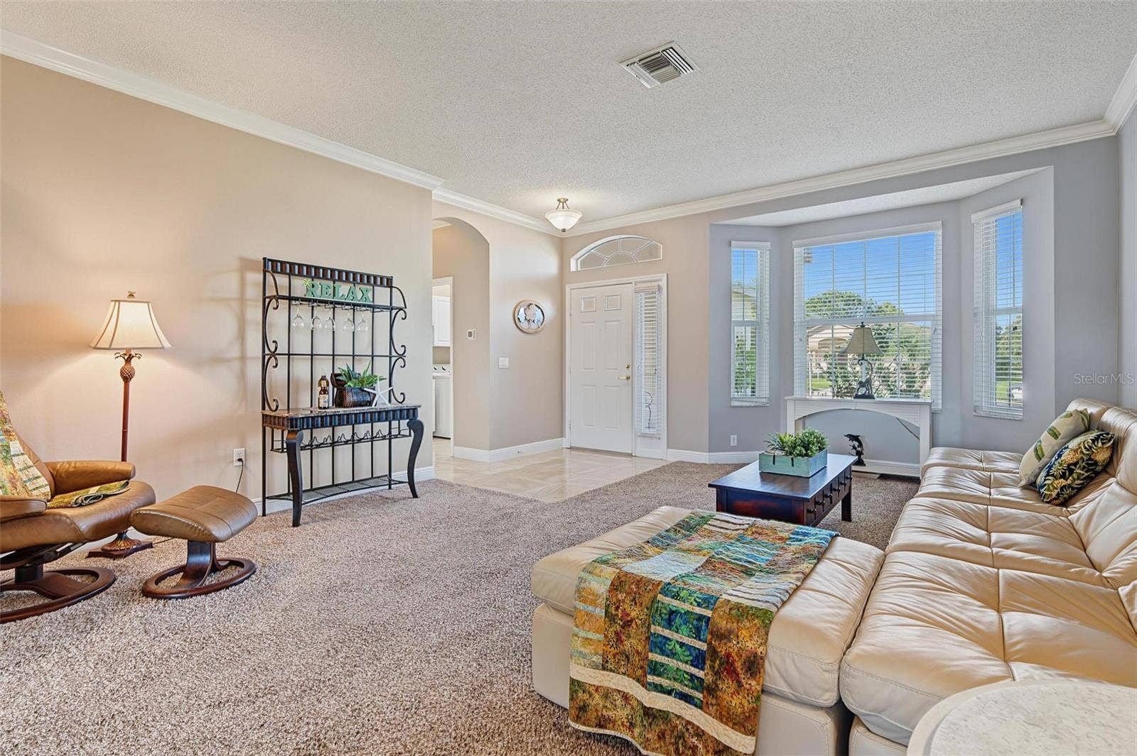1929 WESTERHAM LOOP, Trinity, FL 34655 Separate living room off foyer with bay window