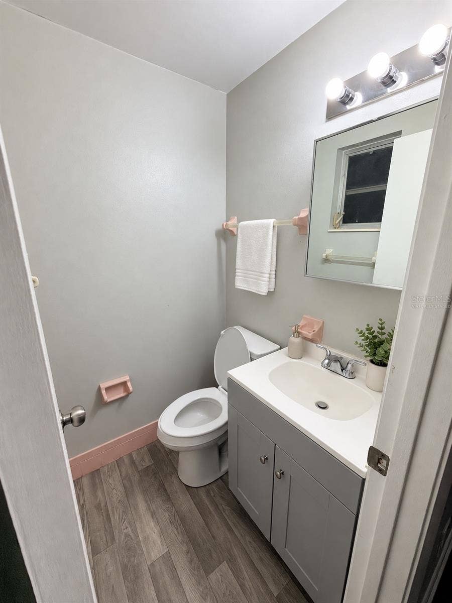 4581 DELTONA BOULEVARD, Spring Hill, FL 34606 Virtually Staged Half Bathroom located in Primary Bedroom