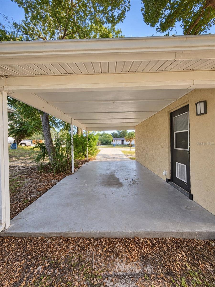 4581 DELTONA BOULEVARD, Spring Hill, FL 34606 View of Carport from Yard