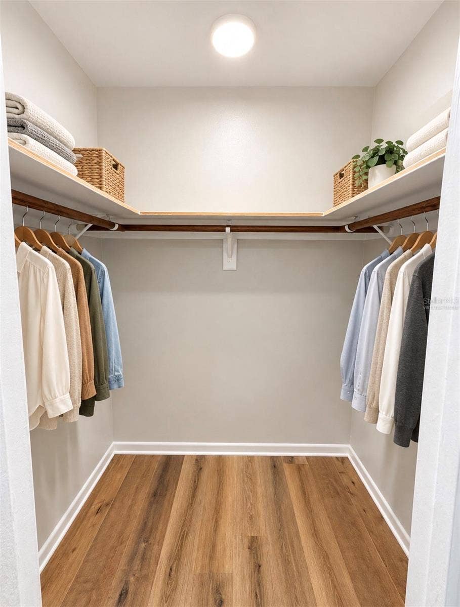 4581 DELTONA BOULEVARD, Spring Hill, FL 34606 Virtually Staged Primary Bathroom Walk-In Closet