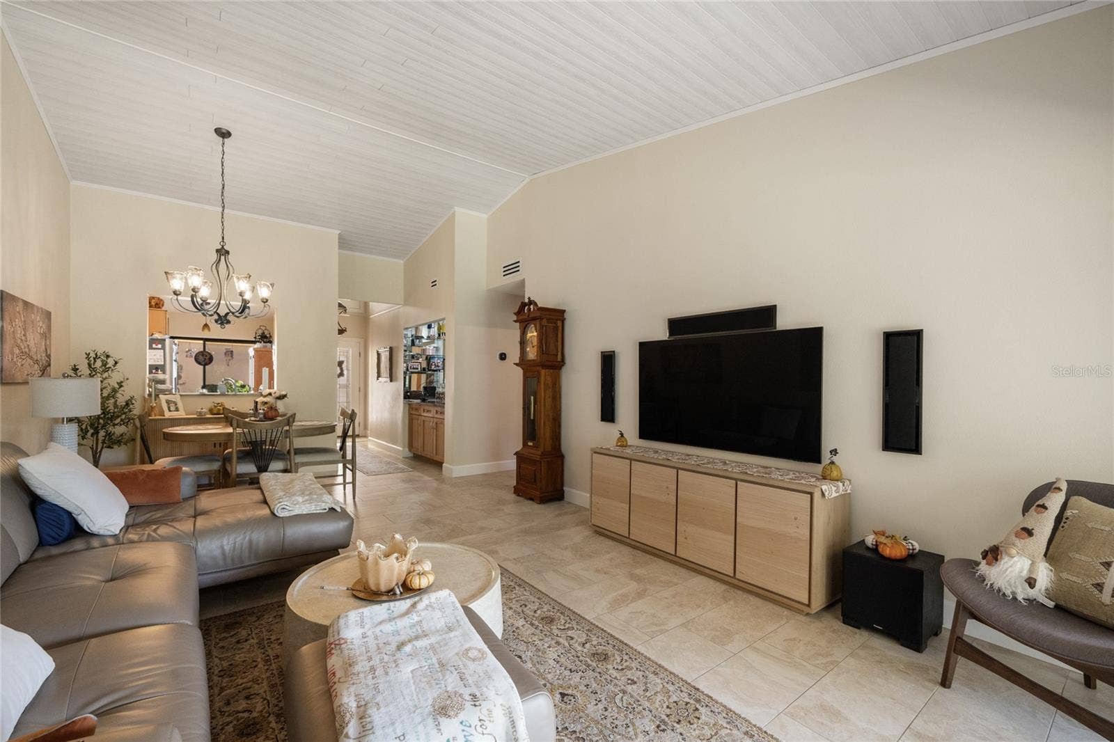 LIVING ROOM AND DINING ROOM AREAS HAVE WHITE TONGUE AND GROVE WOOD PLANK VAULTED CEILING.  LIVING ROOM IS WIRED FOR 5.1 SURROUND SOUND.