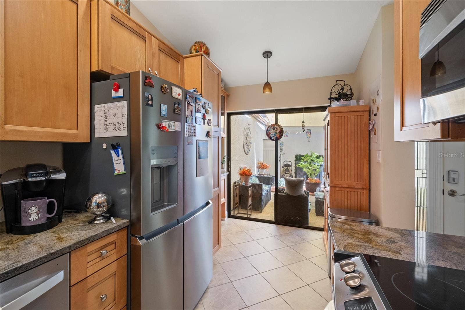 KITCHEN WITH SLIDING DOORS OUT TO THE COURTYARD